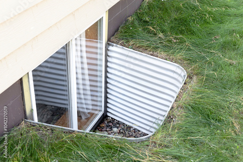 Basement egress window. Egress window well photo