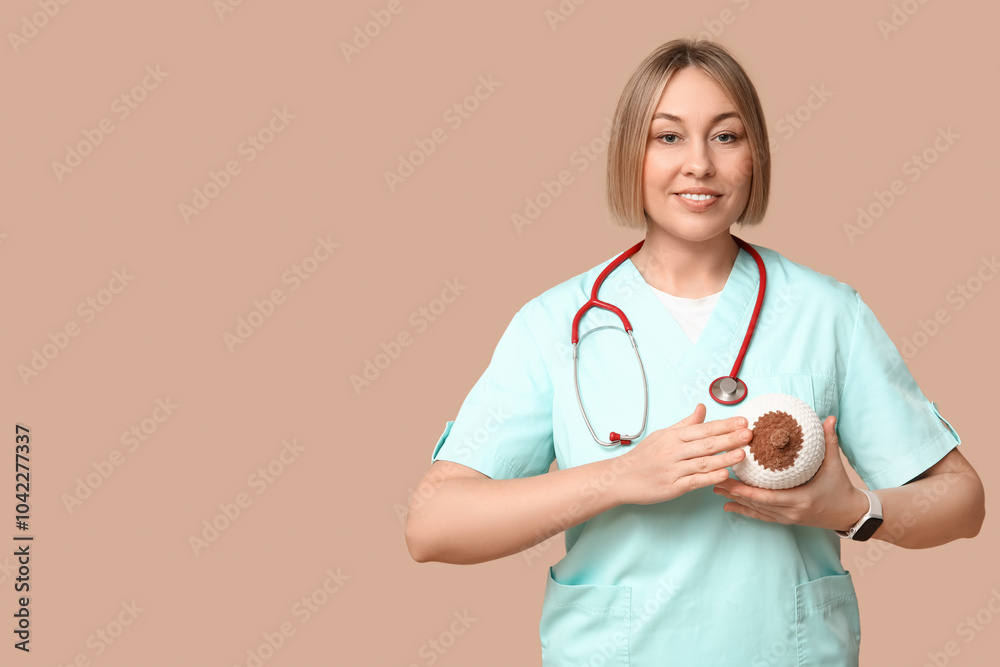 Female doctor with stethoscope and knitted model of breast on brown background. Breast feeding concept Female doctor with stethoscope and knitted model of breast on brown background. Breast feeding concept