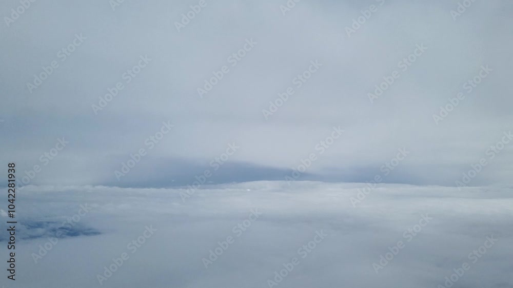 A serene view from above showcasing a vast, soft cloud layer with a gentle blue sky, perfect for themes of tranquility, travel, or nature. ideal for projects focusing on atmospheric beauty and open sp A serene view from above showcasing a vast, soft cloud layer with a gentle blue sky, perfect for themes of tranquility, travel, or nature. ideal for projects focusing on atmospheric beauty and open sp