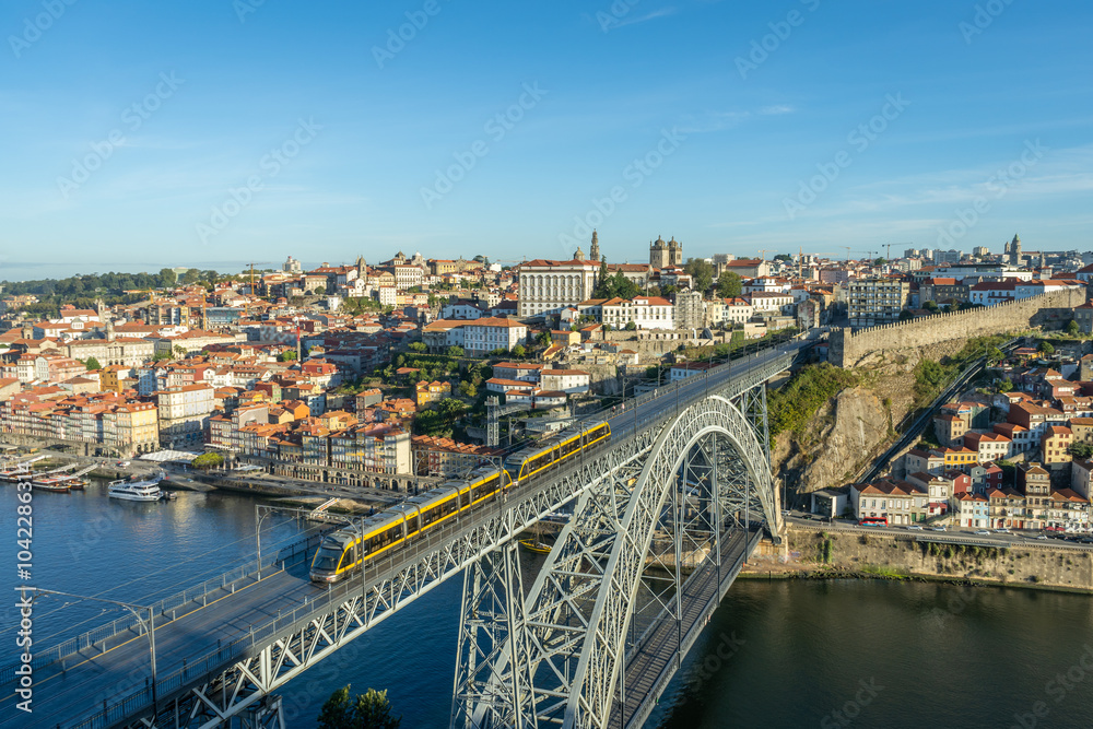 Obraz premium Porto City, Douro River and Dom Luis Bridge I with Tram in Morning. View from Tourist Viewpoint Miradouro da Serra do Pilar. Portugal