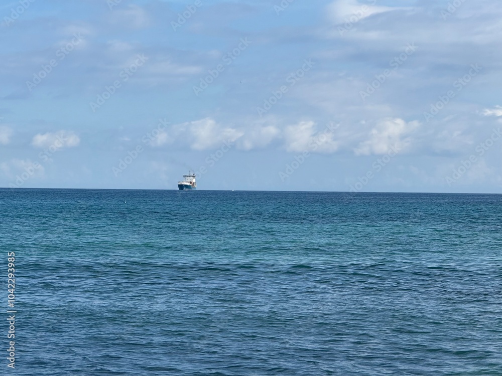 Fototapeta premium Sea, sky and little ship
