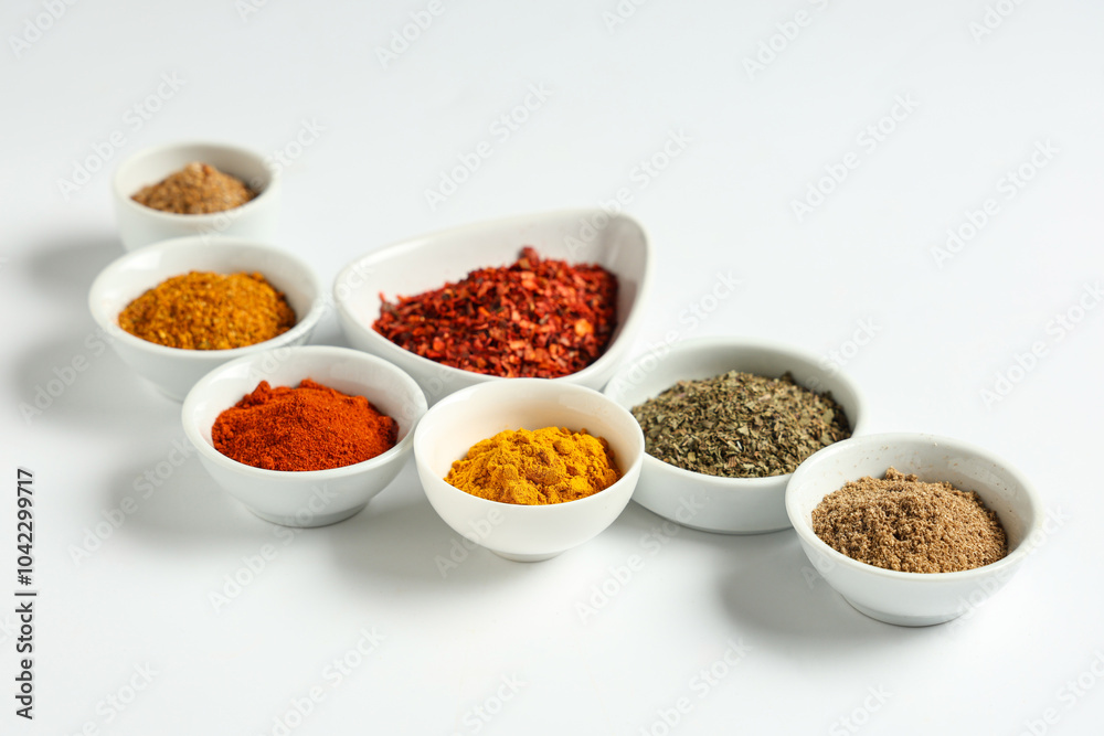 Bowls with fresh aromatic spices on light background Bowls with fresh aromatic spices on light background