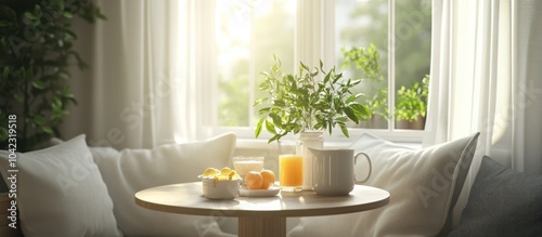 A cozy breakfast nook with a table set for one by a sunny window, featuring a glass of orange juice, a white mug, and a bowl of fruit.