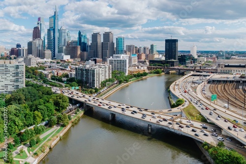 Traffic on the Vine St Expressway crossing the Schuylkill River and the downtown city skyline of Philadelphia, Pennsylvania, United States.