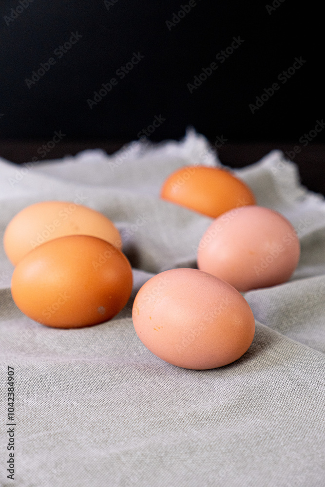 Brown eggs on gray napkin. Vertical photo Brown eggs on gray napkin. Vertical photo