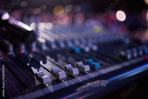 This is a professional audio mixing console that features colorful faders for enhanced usability