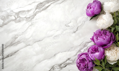 Beautiful flowers bouget with peonies and roses with a beautiful bundling. Bouquet is lying on a white marble table as a background photo