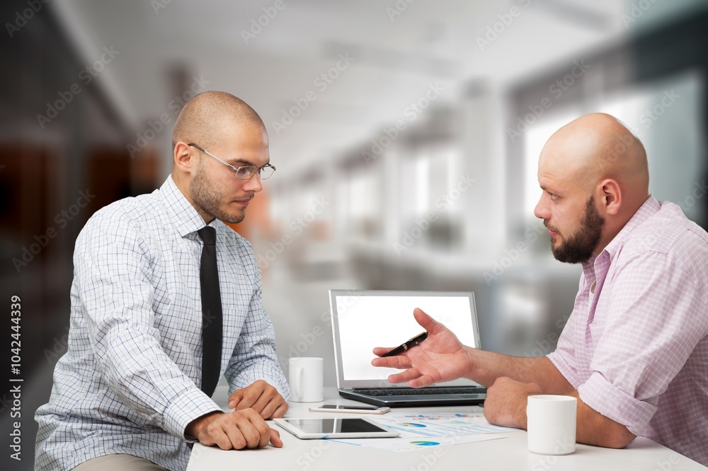 Young business colleagues, partners signing a contract. Young business colleagues, partners signing a contract.