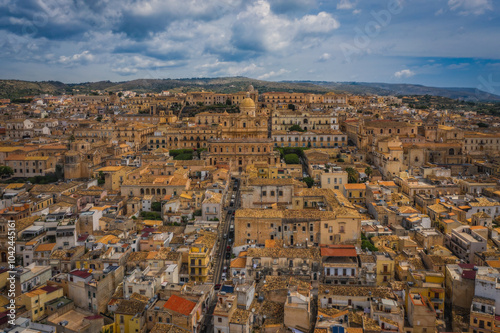 Cityscape of Noto with the cathedral of St. Nicholas of Myra San Nicolo , small town near Syracuse Siracusa , Sicily island, Italy, Europe. Aerial panoramoc picture. June 2023