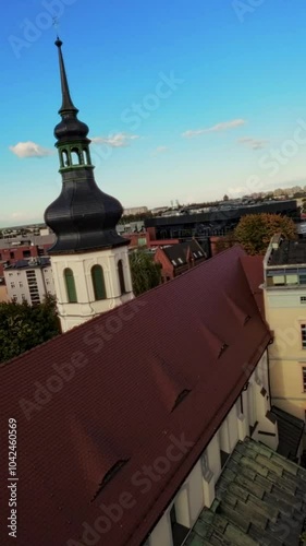 This is a breathtaking aerial tour of the Old City of Warsaw, Poland . The video features stunning 4K footage of the citys historic buildings, churches, and monuments, as well as the beautiful parks
