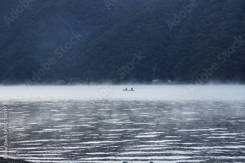 boat on the misty lake