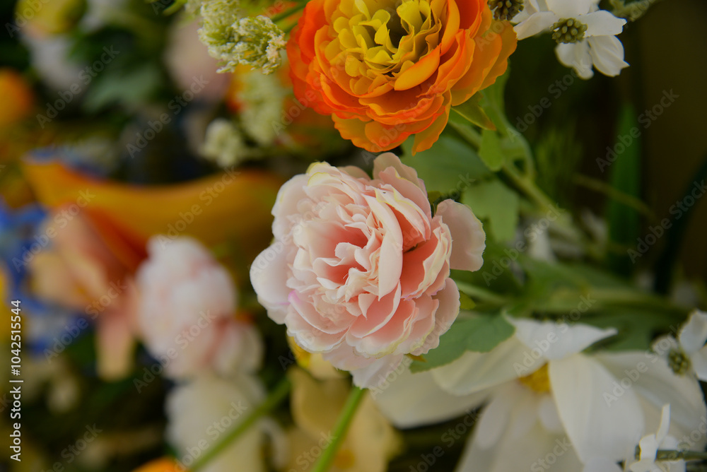 Fototapeta premium Artificial flowers as a background. Flower texture background