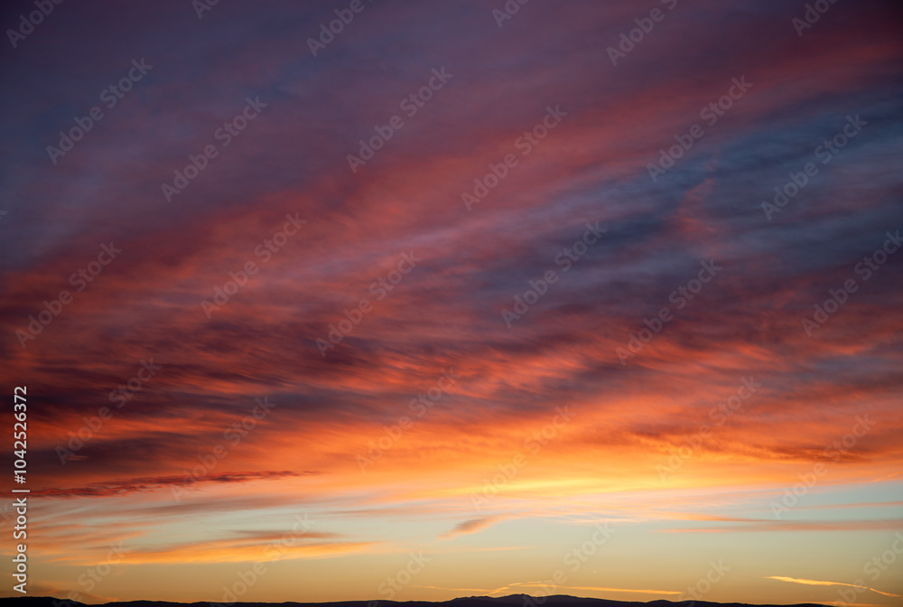 Fototapeta premium Dramatic red sunset in Wyoming orange blues