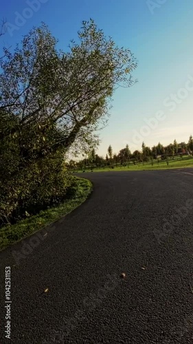 This FPV drone footage takes you on a journey through a beautiful park. The drone flies over lush trees, past a babbling brook, and under a picturesque bridge. Youll feel like youre soaring through