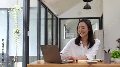 business asian woman working with laptop and papers at office. Accounting financial concept