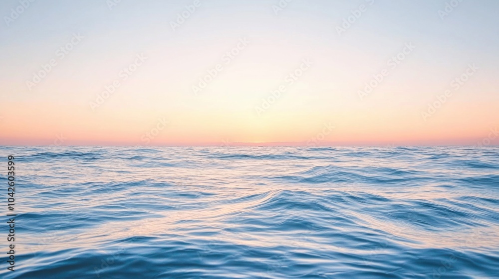 Serene ocean waves under a pastel sky during sunrise or sunset. Tranquil seascape Serene ocean waves under a pastel sky during sunrise or sunset. Tranquil seascape