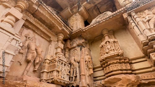 Closup of Indian Ancient Hindu Temple Sculptures on wall, a historic temple made with stone carving and art sculptures in India. At Sas-Bahu Twin Temples, are the11th-century twin temples in Gwalior, 