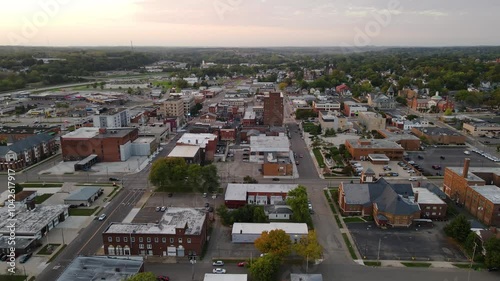 Aerial view of downtown Massillon, Ohio at sunset featuring historic buildings and streets. Crane Down Left Sunset N photo