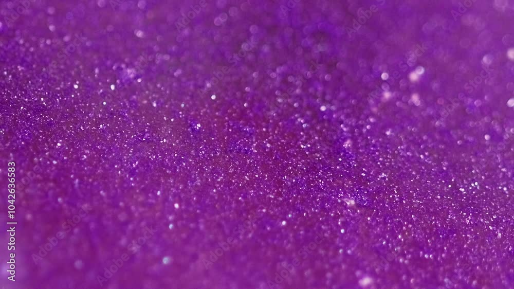 Sparkling background. Bokeh light. Defocused shimmering purple white color glowing particles grain wave motion abstract art texture. Sparkling background. Bokeh light. Defocused shimmering purple white color glowing particles grain wave motion abstract art texture.