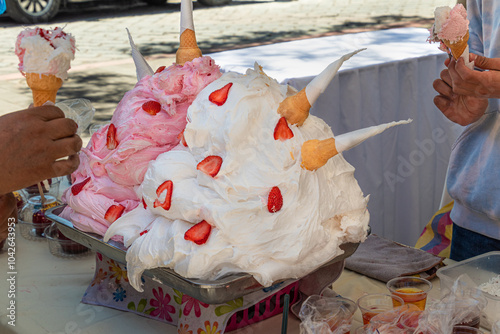 Espumilla de guayaba (guava foam) is a traditional Ecuadorian dessert made with egg whites and flavored with guava, served in ice cream cones.