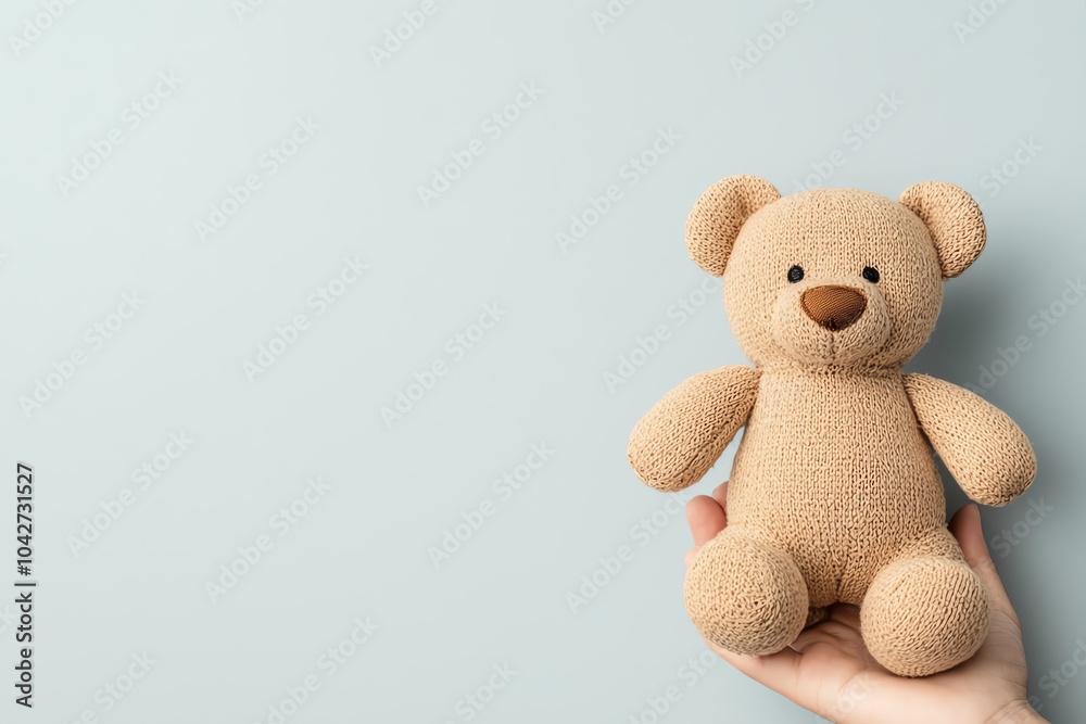 Obraz premium A cozy companion embracing the comfort of a plush bear in your hands