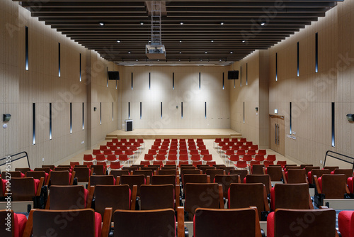 Auditorium interior with neat rows of empty seats