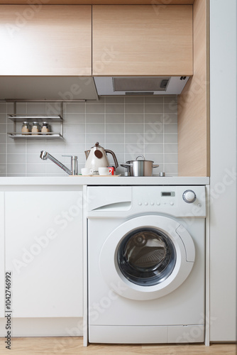 Modern kitchen with a washing machine photo