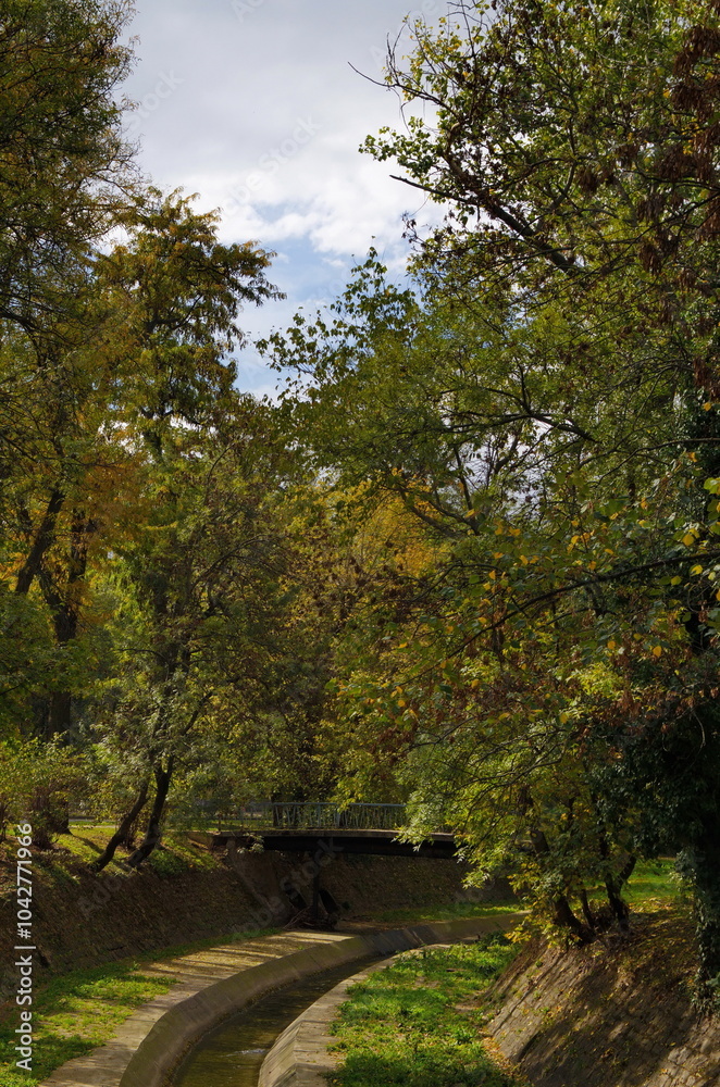 A view of part of the picturesque autumn riverbed with a bridge over the Perlovska River passing through the city of Sofia, Bulgaria A view of part of the picturesque autumn riverbed with a bridge over the Perlovska River passing through the city of Sofia, Bulgaria