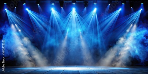 description: The searchlight beams of blue light through theatrical smoke photo