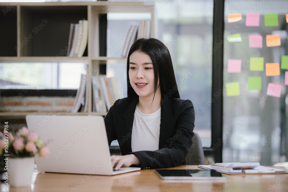 Asian woman using calculator to calculate financial expenses in home office. Pressing calculator button to analyze finances, electronic payments. Asian woman using calculator to calculate financial expenses in home office. Pressing calculator button to analyze finances, electronic payments.