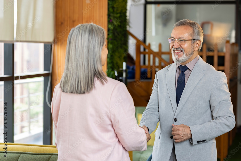 Business people standing together having handshake Business people standing together having handshake