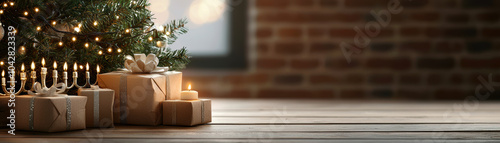 A cozy holiday scene featuring a decorated Christmas tree, gifts, and glowing candles, all set against a rustic brick background. photo