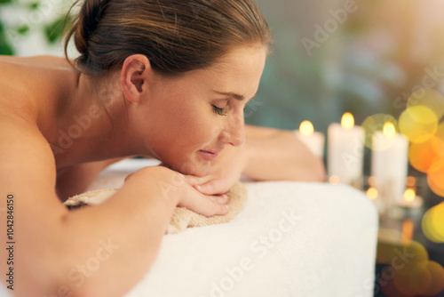 Face, massage and sleeping with happy woman in spa to relax as customer for hospitality or wellness. Calm, healing and peace with person in luxury hotel or salon for detox, retreat or treatment