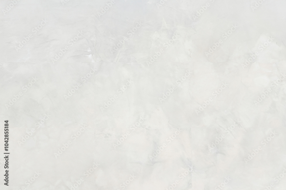 Close-up of a light, textured plaster wall with subtle patterns and an abstract design, ideal for backgrounds. Close-up of a light, textured plaster wall with subtle patterns and an abstract design, ideal for backgrounds.