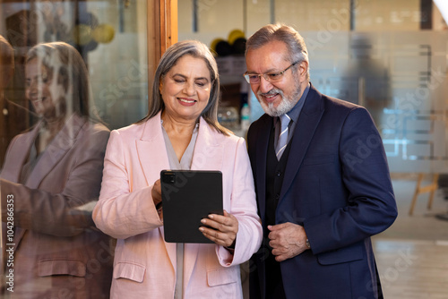 Photography Seniors business people enjoying work together using tablet for online project d
