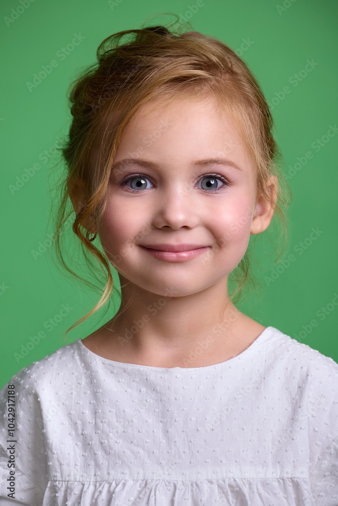 Portrait of a cute little girl in a studio on a green background (chromakey) Portrait of a cute little girl in a studio on a green background (chromakey)