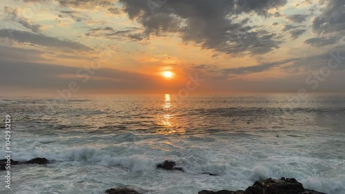A beautiful sunset on a spring evening along the popular promenade at Sea Point beach near Cape Town in South Africa.