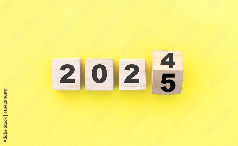 Wooden Cube turns from 2024 to 2025, new year 2025 concept Wooden Cube turns from 2024 to 2025, new year 2025 concept