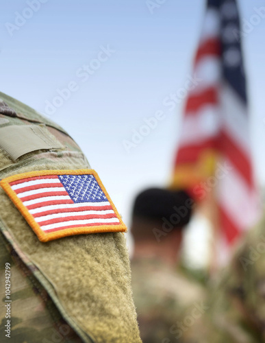 US soldiers. US army. USA patch flag on the US military uniform. Soldiers on the parade ground from the back. Veterans Day. Memorial Day.