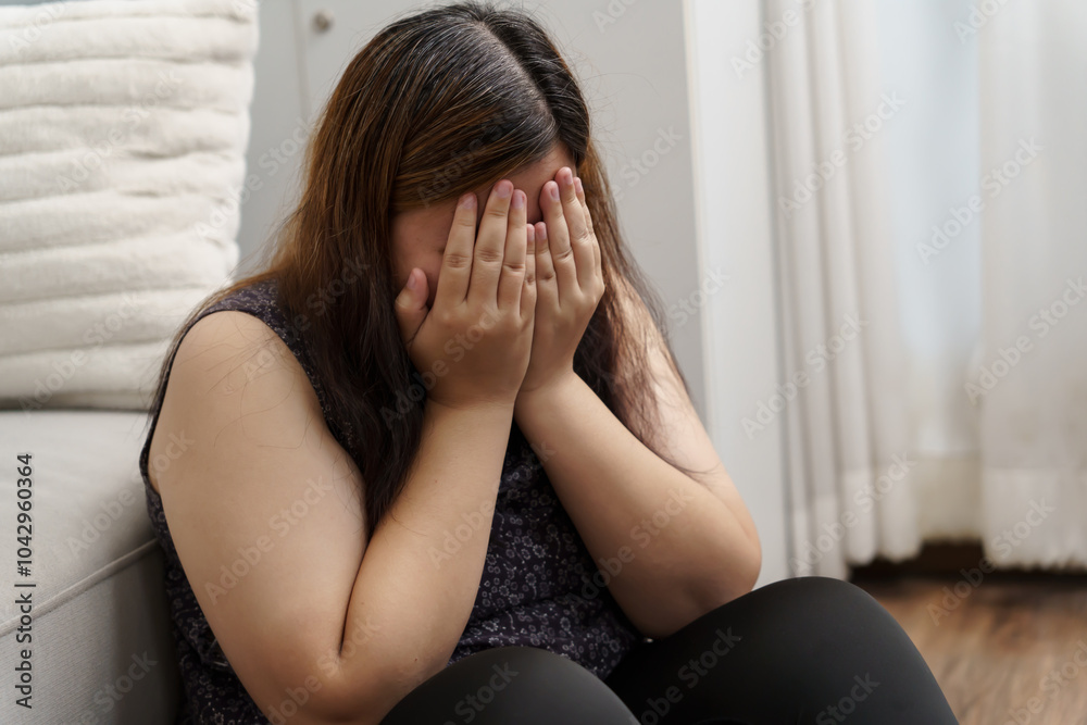 Sad Overweight plus size woman thinking about problems on sofa upset girl feeling lonely and sad from bad relationship or Depressed woman disorder mental health Sad Overweight plus size woman thinking about problems on sofa upset girl feeling lonely and sad from bad relationship or Depressed woman disorder mental health