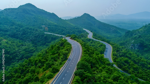 Aerial view asphalt road on green forest, Curve asphalt road on mountain green forest 