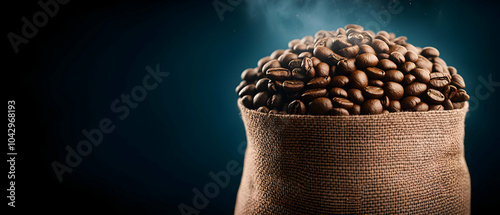 Freshly roasted coffee beans spilling out from a burlap sack, with steam rising against a dark background. photo