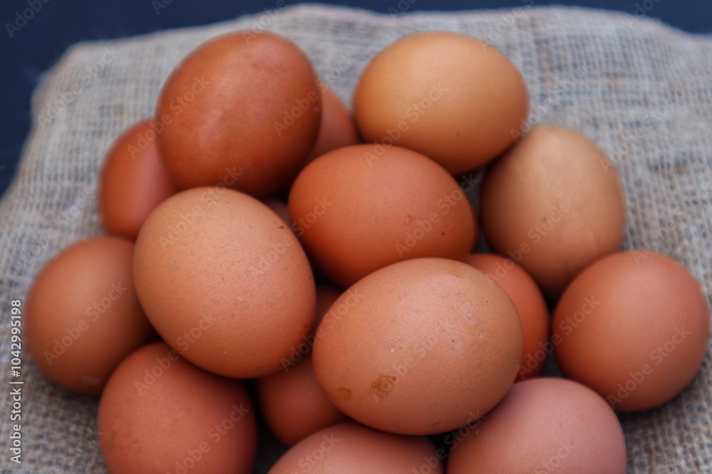Chicken eggs are made in a pile with a close up view. Chicken eggs are made in a pile with a close up view.