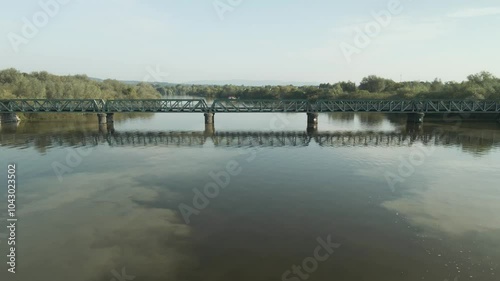 Parteen Railway Bridge With Reflection Over The River Shannon In Limerick, Ireland. Aerial Drone Shot photo