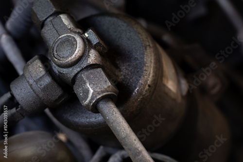 Leaked air condition system of the cars. AC refrigerant leaking shown on sight glass and receiver drier. Background for car maintenance or automobiles. Selective focus and copy space.