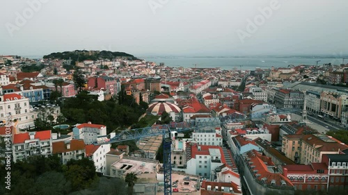 Drone view just above Lisbon’s city center, capturing its historic architecture, streets, and vibrant urban atmosphere.