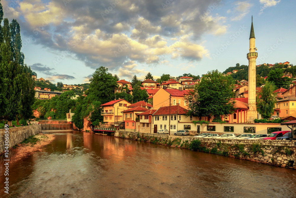 Naklejka premium the center of Sarajevo with the river Miljacka and the mine mosque Hadzijska