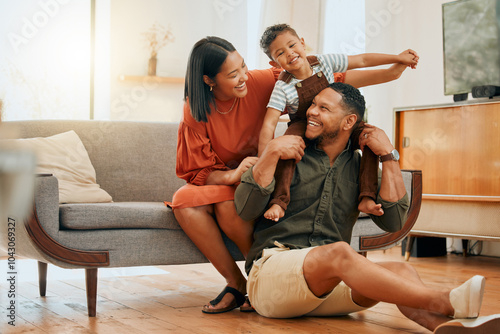 Support, airplane and energy with family on sofa for love, playful game and happiness. Care, bonding and laughing with child on shoulders of parent in living room at home for silly, comedy and funny