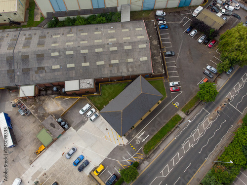 Aerial drone photo of a large warehouse and storage unit located in the town of Hunslet in the city of Leeds in West Yorkshire in the UK showing the large distribution site and roads from above photo