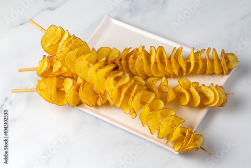Obraz na płótnie Roasted Tornado or twisted potatoes (Turkisn name; Cubukta patates) w salonie